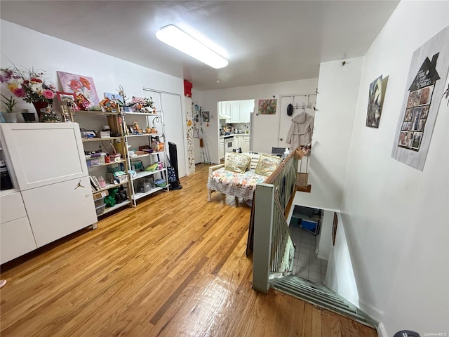 interior space featuring white cabinets and light hardwood / wood-style flooring