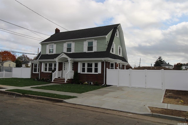 view of front of home with a front yard