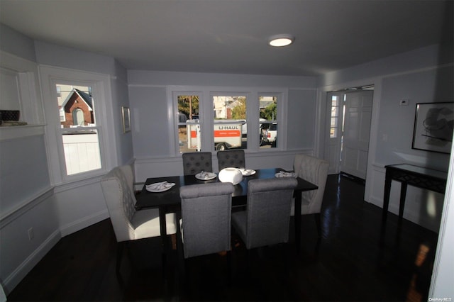 dining area featuring dark wood-type flooring