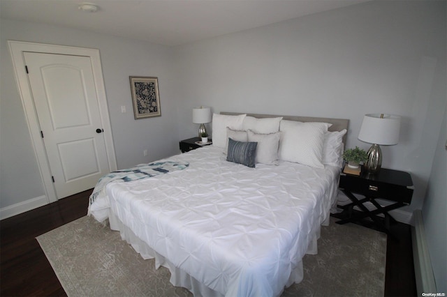 bedroom featuring dark wood-type flooring