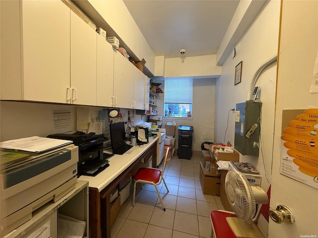 kitchen with white cabinets and light tile patterned floors