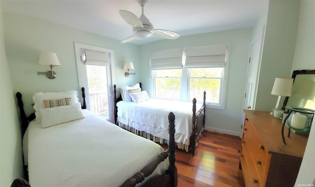 bedroom with dark hardwood / wood-style floors, ceiling fan, and access to outside