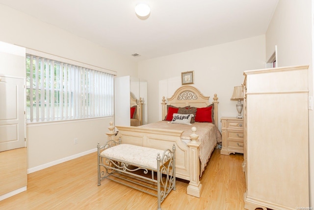 bedroom with light wood-type flooring