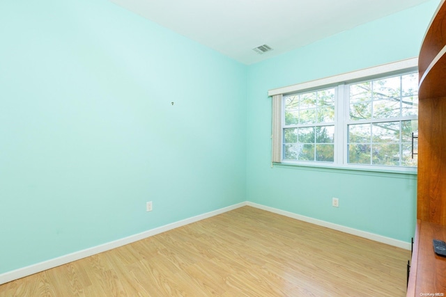 unfurnished room with light hardwood / wood-style flooring