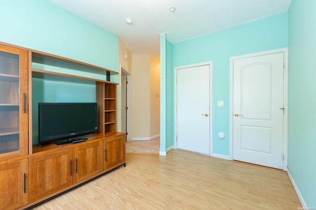 unfurnished living room with light hardwood / wood-style flooring