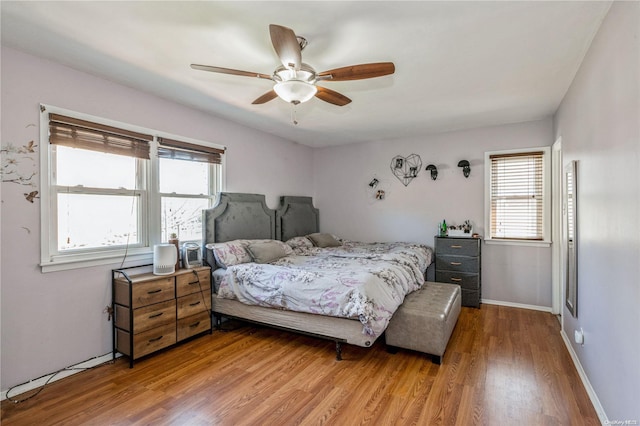 bedroom featuring hardwood / wood-style flooring and ceiling fan