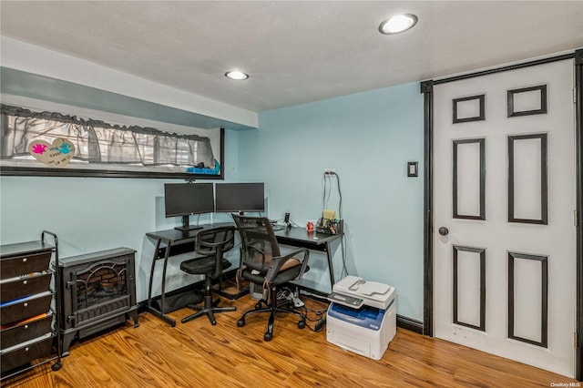 office with hardwood / wood-style flooring