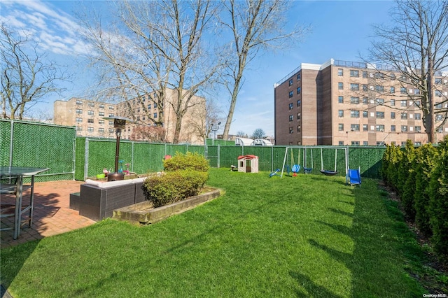 view of yard with a playground, a patio, and an outdoor hangout area