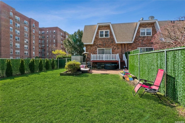 rear view of house featuring a lawn, a patio area, and a deck