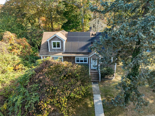 view of front of home featuring solar panels