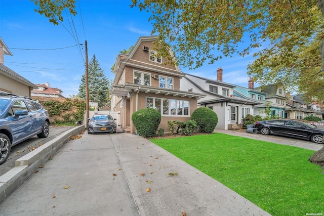 view of front of home with a front lawn