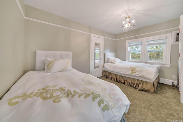 bedroom featuring carpet flooring and a notable chandelier