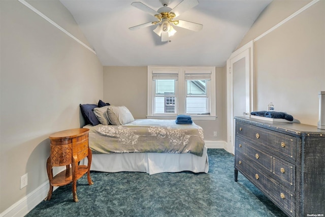 carpeted bedroom with ceiling fan and lofted ceiling