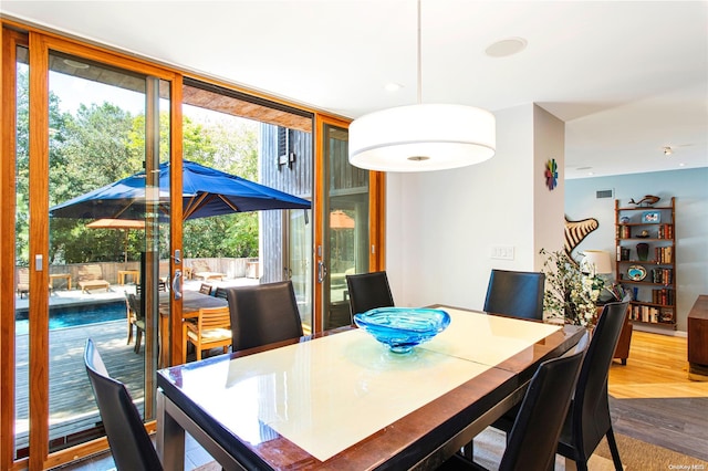 dining room with hardwood / wood-style flooring