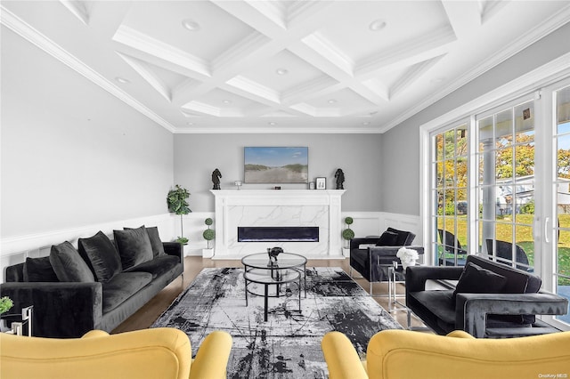 living room featuring coffered ceiling, beamed ceiling, crown molding, and a fireplace