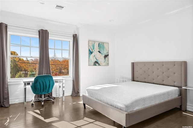 bedroom featuring crown molding, multiple windows, and dark hardwood / wood-style flooring