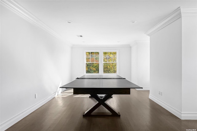 playroom with dark wood-type flooring and ornamental molding