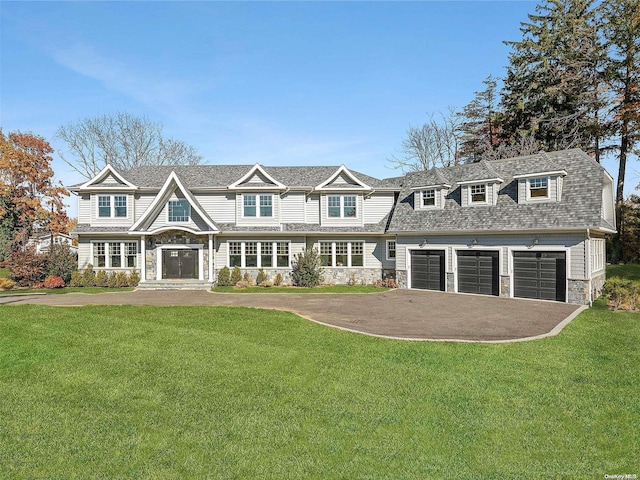 view of front of property featuring a garage and a front lawn