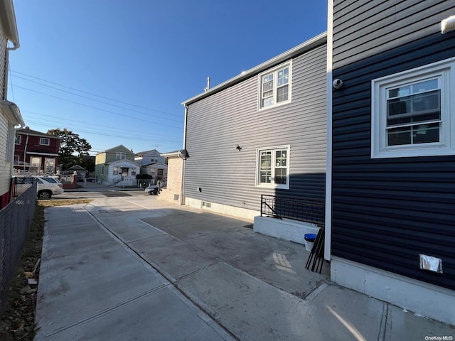 view of side of property with a patio