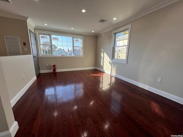 unfurnished room with dark hardwood / wood-style floors and crown molding