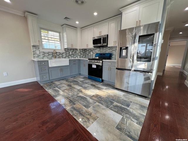 kitchen featuring gray cabinets, sink, white cabinets, and appliances with stainless steel finishes