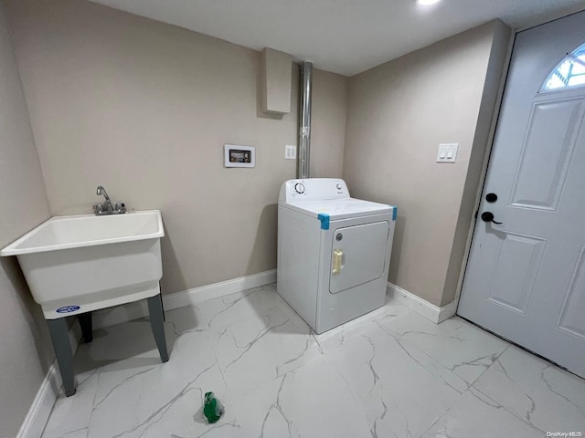 washroom with washer / clothes dryer and sink