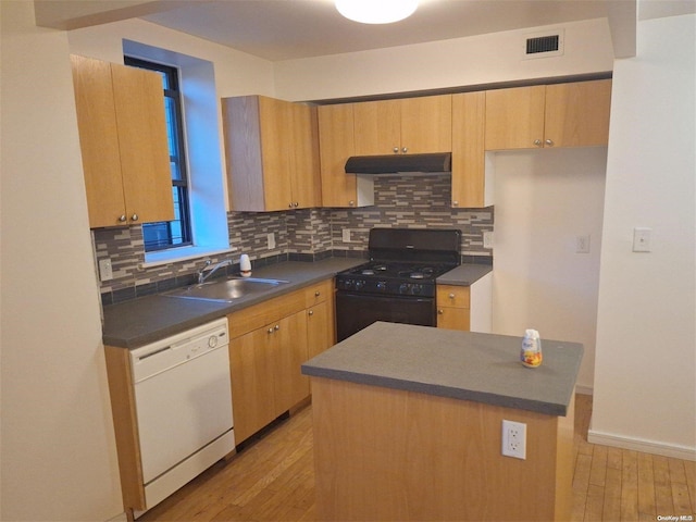 kitchen featuring gas stove, white dishwasher, light hardwood / wood-style flooring, and sink