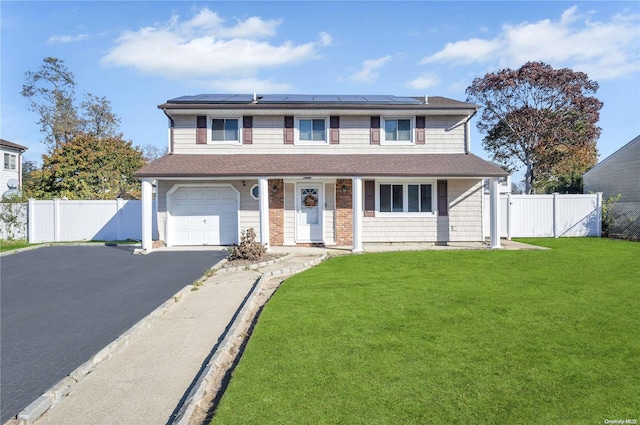 view of front facade featuring solar panels, a garage, and a front lawn