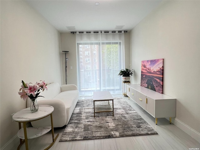 living room with light hardwood / wood-style floors