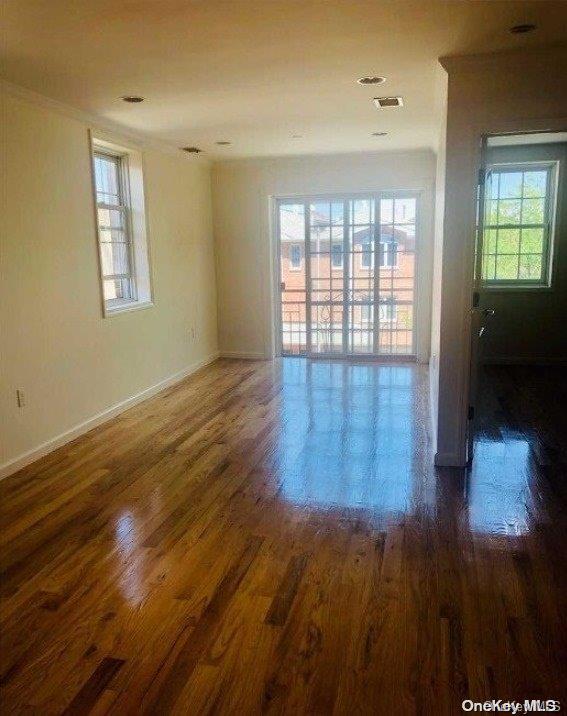 unfurnished room featuring dark wood-type flooring