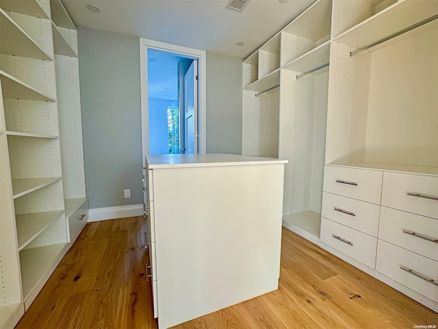 spacious closet featuring light wood-type flooring