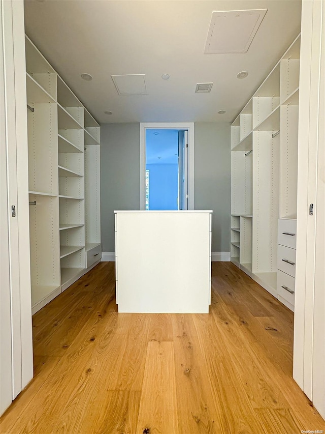 spacious closet featuring light wood-type flooring