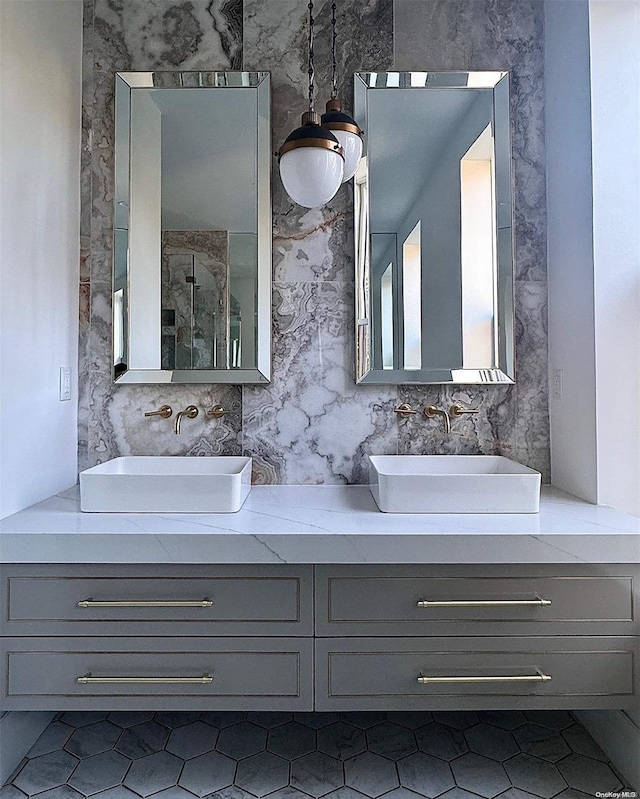 bathroom with tile patterned floors, vanity, and an enclosed shower