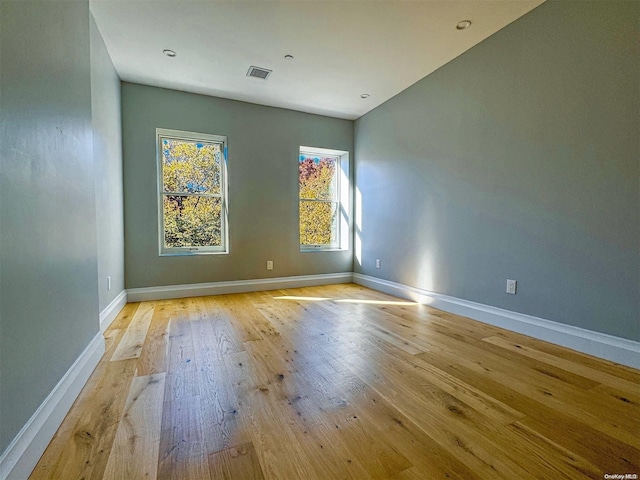 spare room featuring light hardwood / wood-style flooring