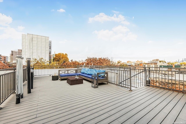 wooden terrace featuring outdoor lounge area