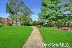 view of home's community featuring a lawn