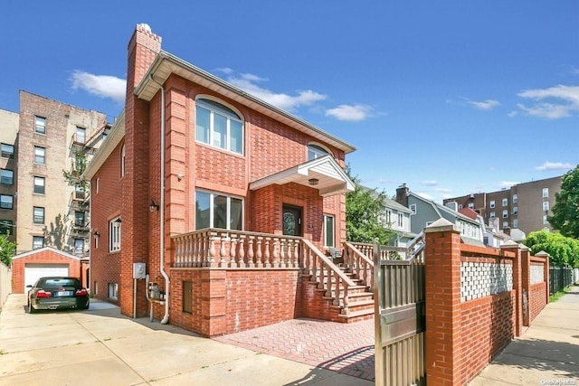 view of front of house with an outbuilding and a garage