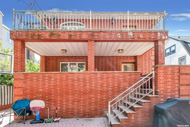 exterior space with a balcony and grilling area