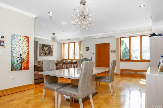 dining space with light parquet flooring, an inviting chandelier, and ornamental molding