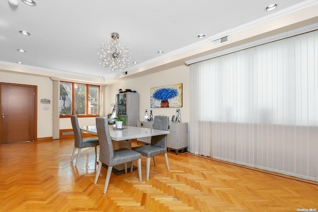 dining space featuring a notable chandelier, crown molding, and light parquet floors