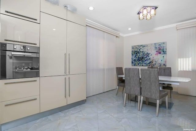 dining space featuring ornamental molding