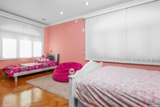 bedroom with parquet flooring and crown molding