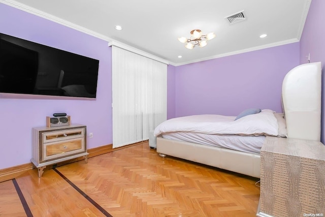 bedroom with light parquet flooring and crown molding