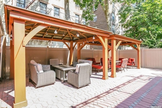 view of patio featuring a gazebo and outdoor lounge area