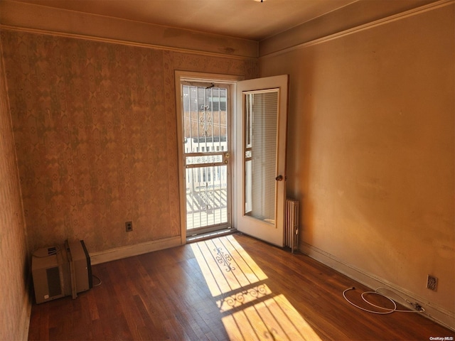 unfurnished room featuring dark hardwood / wood-style flooring