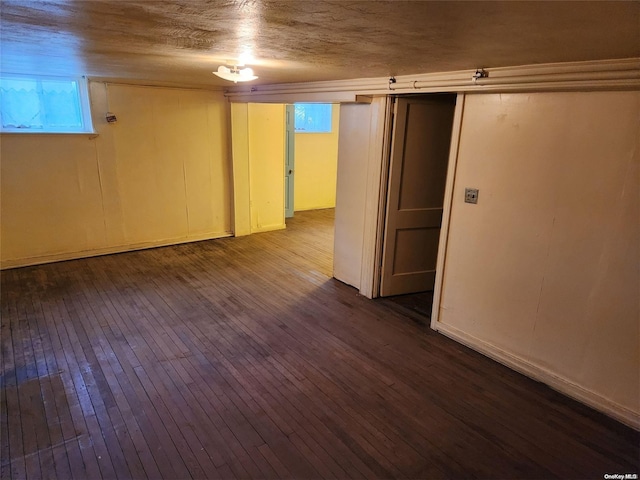 basement featuring hardwood / wood-style floors