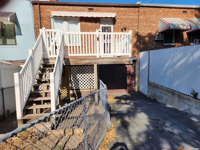 back of property featuring a garage