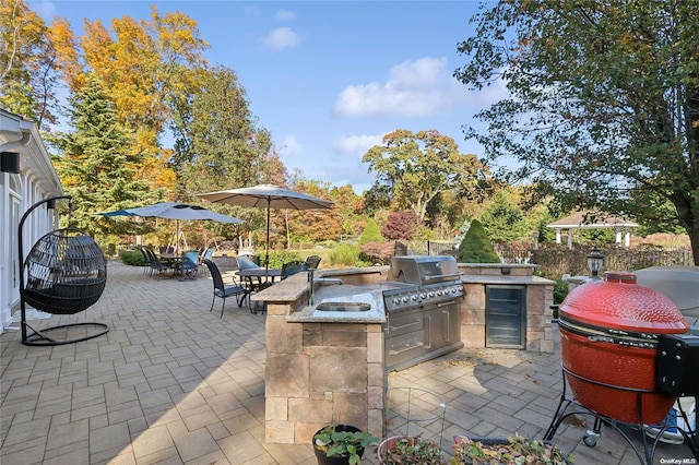 view of patio / terrace featuring sink, grilling area, and exterior kitchen