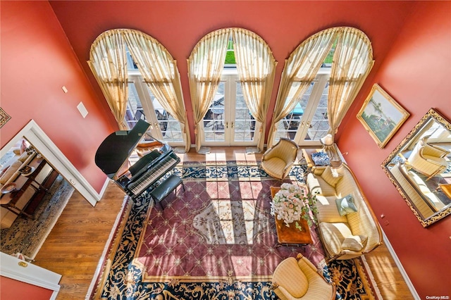 living room with wood-type flooring and french doors