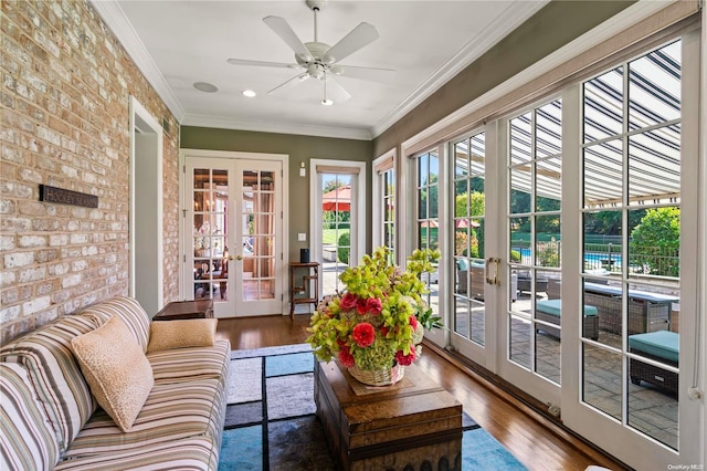 sunroom with ceiling fan and french doors